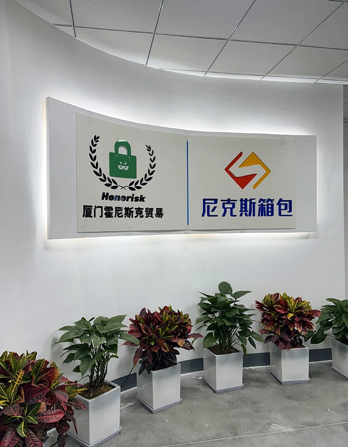 Modern factory floor of Xiamen Honisco Trading Co., Ltd. showing quality control and production.