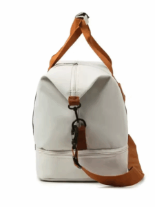 The travel bag open, showcasing the spacious main compartment and clean lining