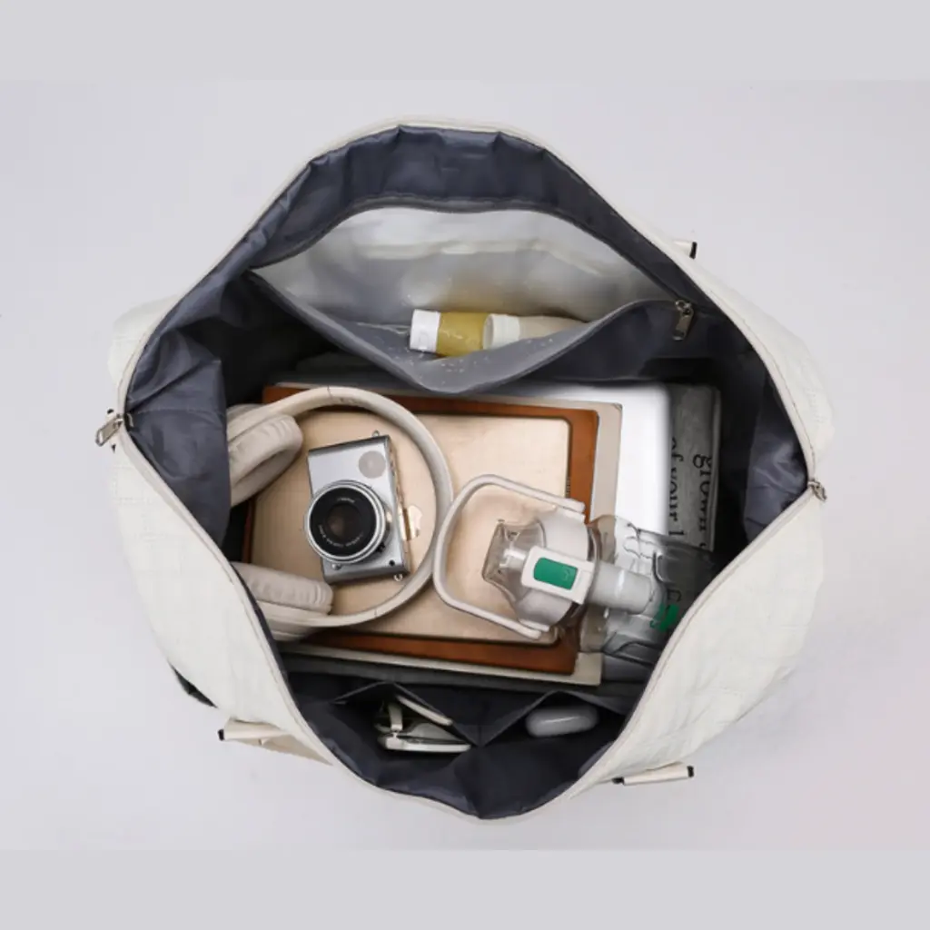 Side view of the tote showing its structured shape and comfortable handles.