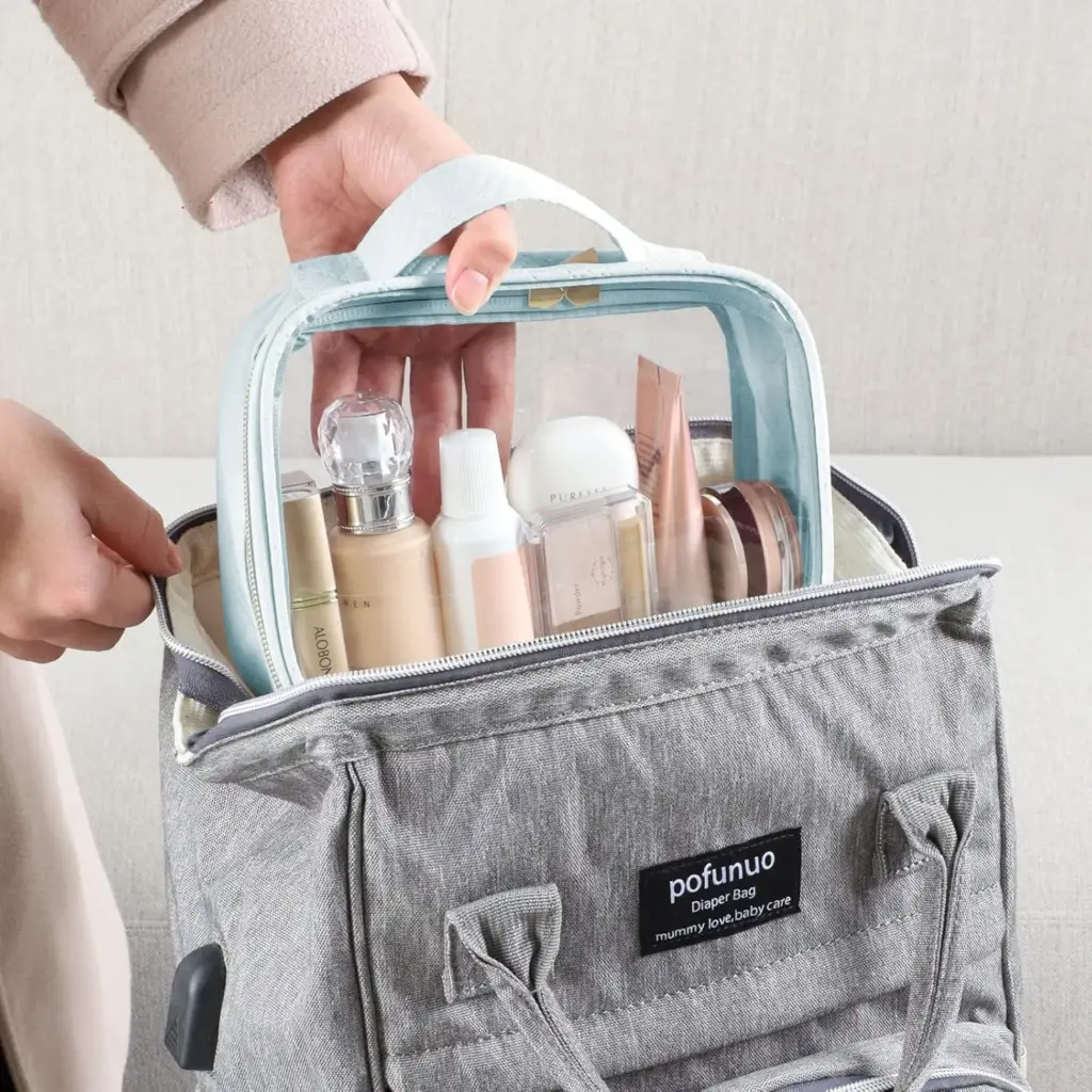Assortment of clear makeup bags in blue, pink, and yellow colors