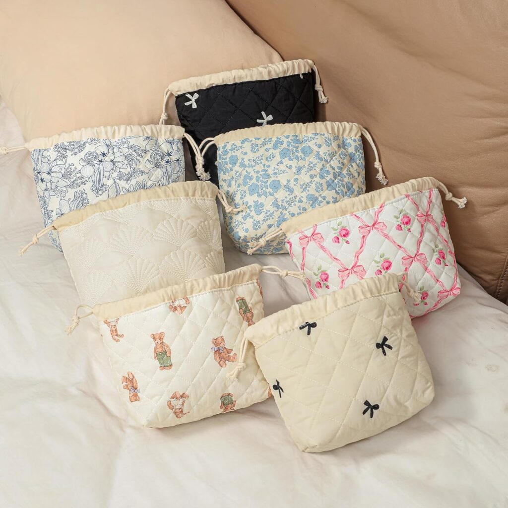 The toiletry bag in a stylish black design, packed with toiletries, demonstrating its capacity and elegant look.