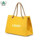 Reusable Heavyweight Canvas Tote Bag in yellow with rope handles and "LOGO" Impresso na frente; Disponível para personalização OEM/ODM. Fotografado em um fundo branco.
