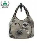 Túumben diseño moda lona Tote yéetel bordado, Nook' u beige, manijas trenzadas, yéetel applique floral. Yile' yéetel le logotipo Honorisk ti' le ti'its'o' superior izquierda. Personalización u OEM yéetel ODM disponible.